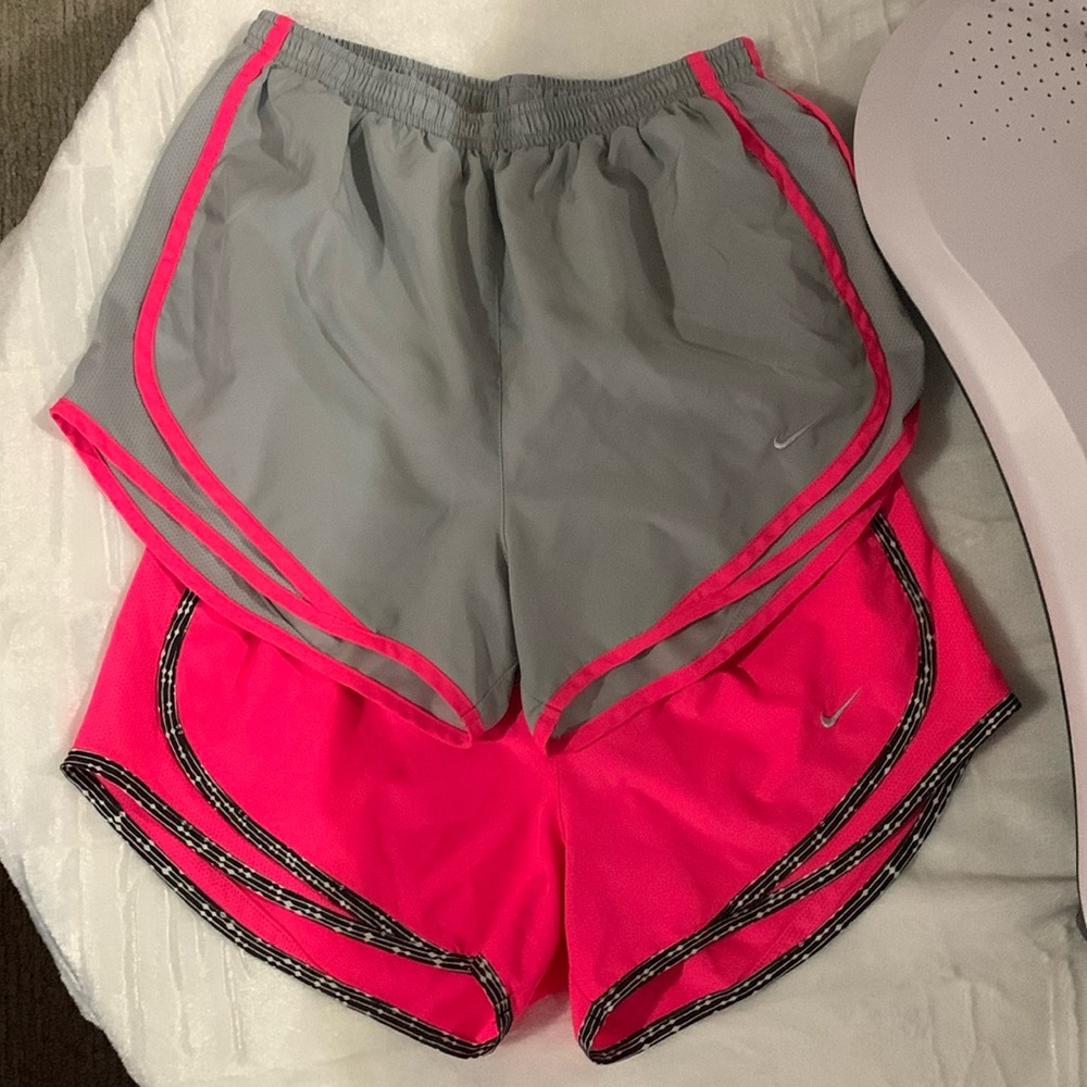 2 pairs of women’s Nike running shorts